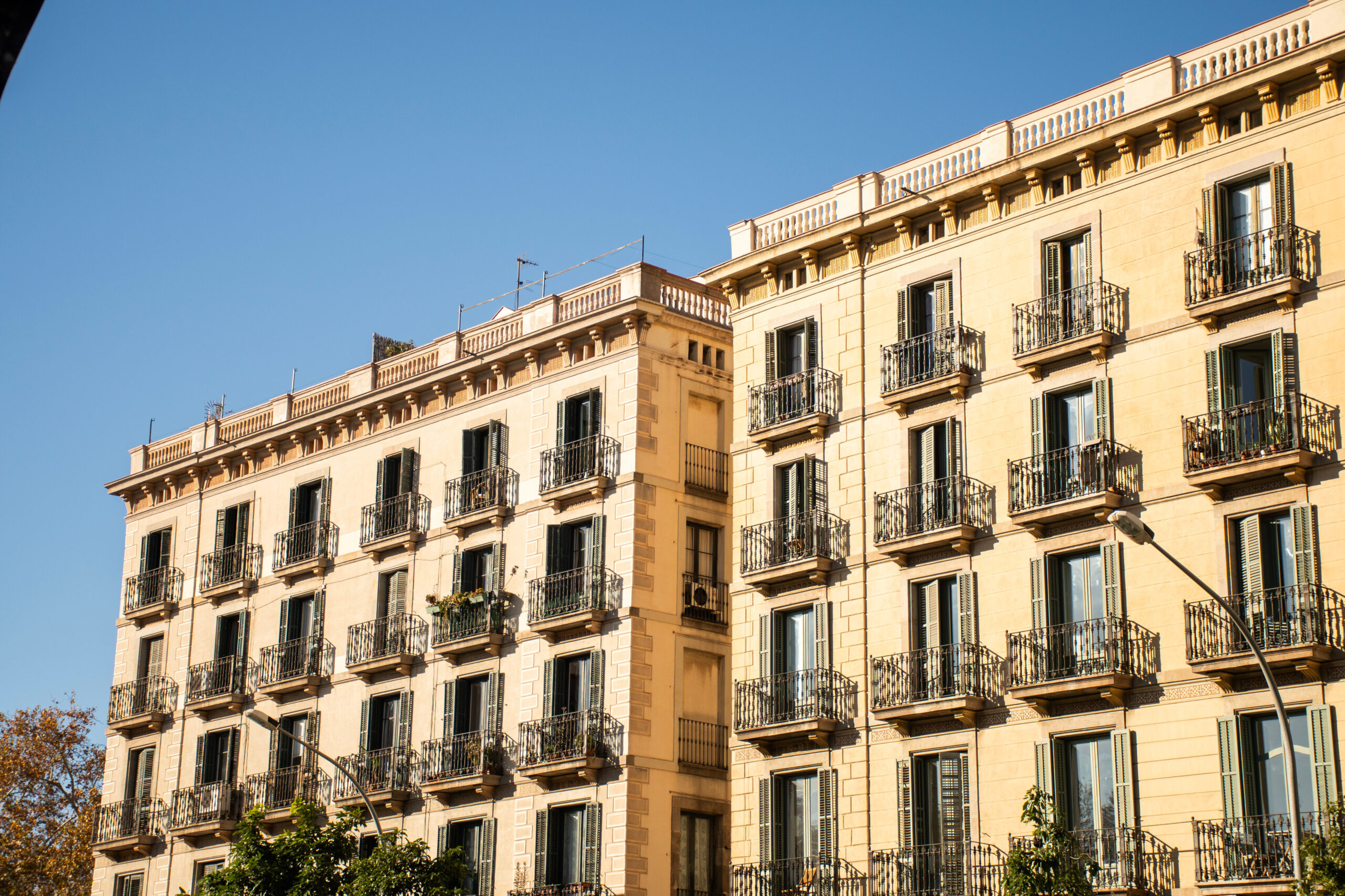 historic hotel building facade with open windows facing the sun on a beautiful and clear day in barcelona in spain Hotel in Hagenberg